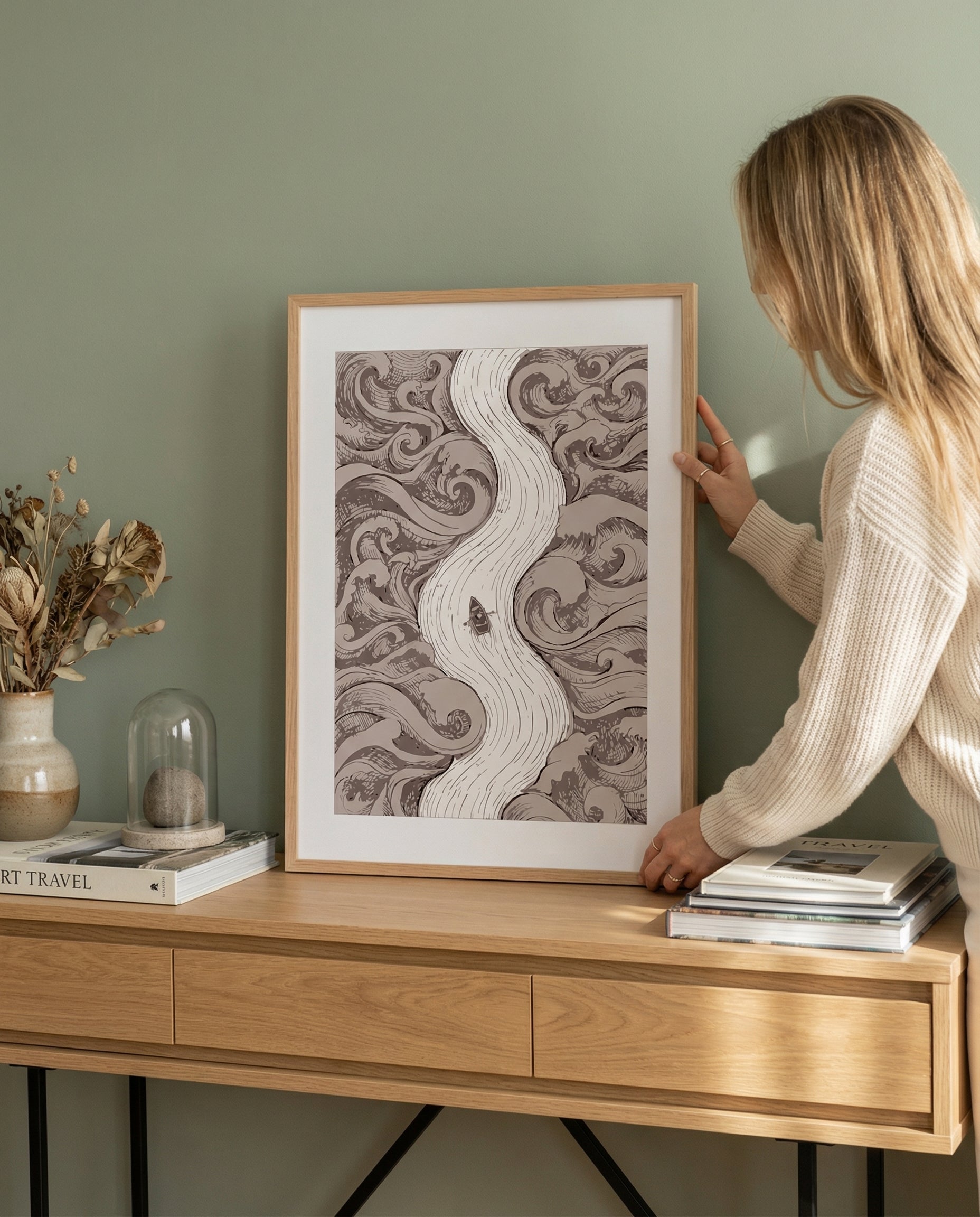 Framed artwork in a softly styled room